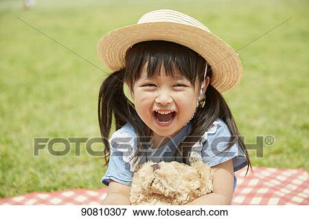 Japanese kid at a city park View Large Photo Image Stock Photo - Japanese kid at a city park. Fotosearch