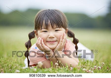 Japanese kid at a city park View Large Photo Image Stock Photo - Japanese kid at a city park. Fotosearch