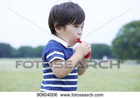 Japanese kid at a city park View Large Photo Image Stock Photograph - Japanese kid at a city park. Fotosearch