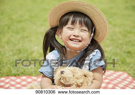 Stock Photograph - Japanese kid at a city park. Fotosearch