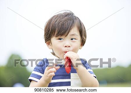 Stock Photography - Japanese kid at a city park. Fotosearch