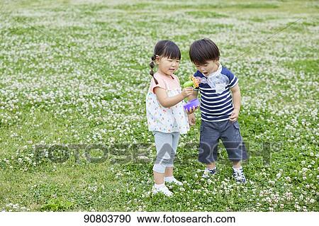 Japanese kids at a city park View Large Photo Image Stock Image - Japanese kids at a city park. Fotosearch