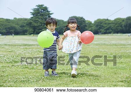 Japanese kids at a city park View Large Photo Image Stock Image - Japanese kids at a city park. Fotosearch