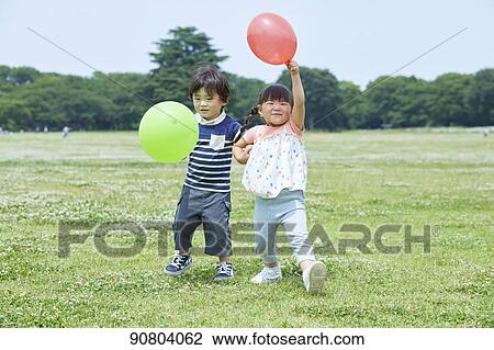 Japanese kids at a city park View Large Photo Image Stock Image - Japanese kids at a city park. Fotosearch
