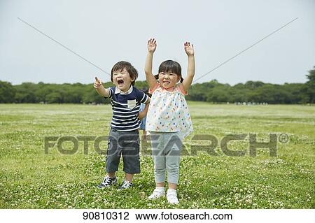 Stock Image - Japanese kids at a city park. Fotosearch