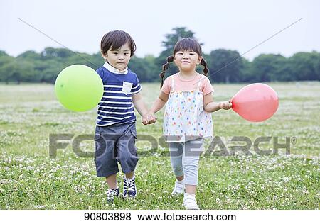 Stock Photo - Japanese kids at a city park. Fotosearch
