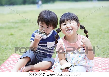 Japanese kids at a city park View Large Photo Image Stock Photo - Japanese kids at a city park. Fotosearch
