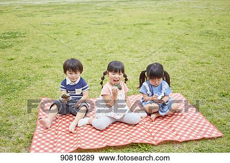 Japanese kids at a city park View Large Photo Image Stock Photo - Japanese kids at a city park. Fotosearch