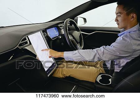 Japanese man in self driving car View Large Photo Image Stock Image - Japanese man in self driving car. Fotosearch