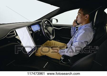 Japanese man in self driving car View Large Photo Image Stock Image - Japanese man in self driving car. Fotosearch