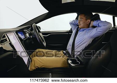 Japanese man in self driving car View Large Photo Image Stock Image - Japanese man in self driving car. Fotosearch