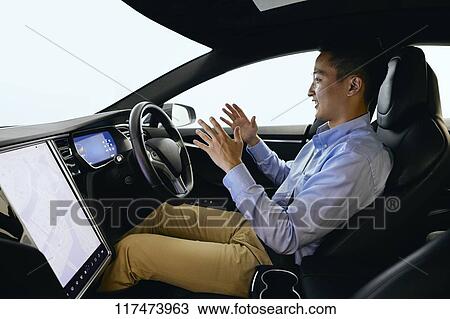 Japanese man in self driving car View Large Photo Image Stock Image - Japanese man in self driving car. Fotosearch