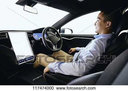 Japanese man in self driving car View Large Photo Image Stock Image - Japanese man in self driving car. Fotosearch