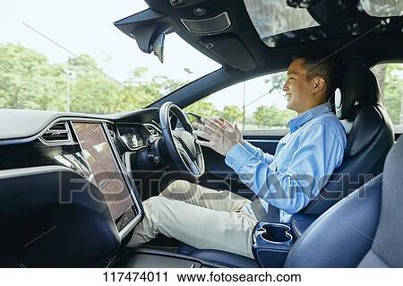 Japanese man in self driving car View Large Photo Image Stock Image - Japanese man in self driving car. Fotosearch