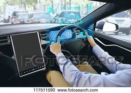 Stock Image - Japanese man in self driving car. Fotosearch