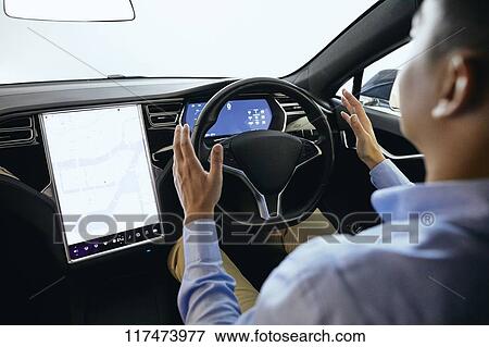 Japanese man in self driving car View Large Photo Image Stock Photo - Japanese man in self driving car. Fotosearch