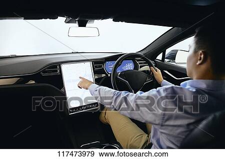 Japanese man in self driving car View Large Photo Image Stock Photo - Japanese man in self driving car. Fotosearch