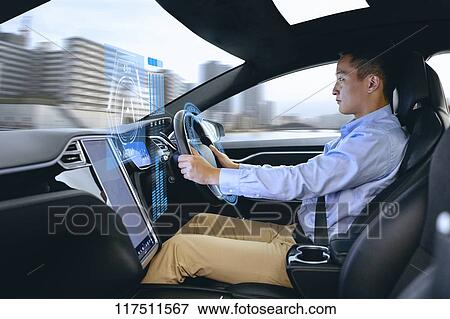 Japanese man in self driving car View Large Photo Image Stock Photo - Japanese man in self driving car. Fotosearch