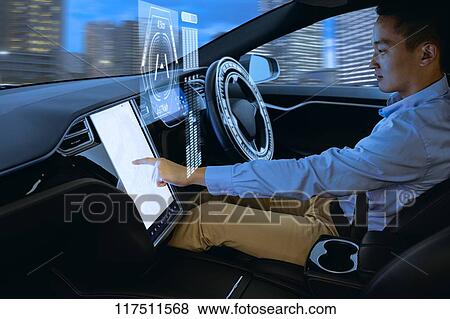 Japanese man in self driving car View Large Photo Image Stock Photo - Japanese man in self driving car. Fotosearch