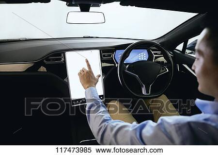 Japanese man in self driving car View Large Photo Image Stock Photography - Japanese man in self driving car. Fotosearch
