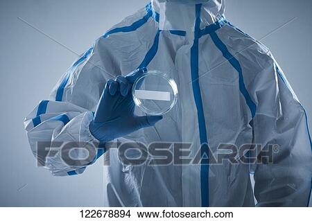 Japanese man wearing protective suit for disease prevention View Large Photo Image Picture - Japanese man wearing protective suit for disease prevention. Fotosearch