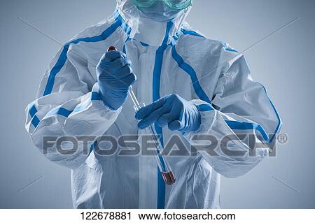 Japanese man wearing protective suit for disease prevention View Large Photo Image Stock Image - Japanese man wearing protective suit for disease prevention. Fotosearch