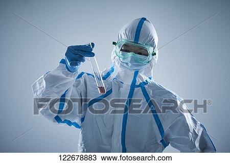 Japanese man wearing protective suit for disease prevention View Large Photo Image Stock Image - Japanese man wearing protective suit for disease prevention. Fotosearch
