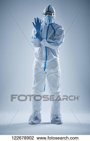 Japanese man wearing protective suit for disease prevention View Large Photo Image Stock Image - Japanese man wearing protective suit for disease prevention. Fotosearch