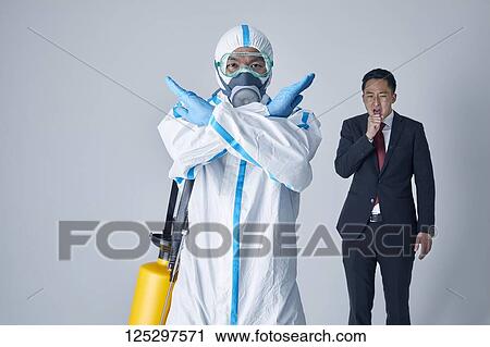 Japanese man wearing protective suit for disease prevention View Large Photo Image Stock Image - Japanese man wearing protective suit for disease prevention. Fotosearch