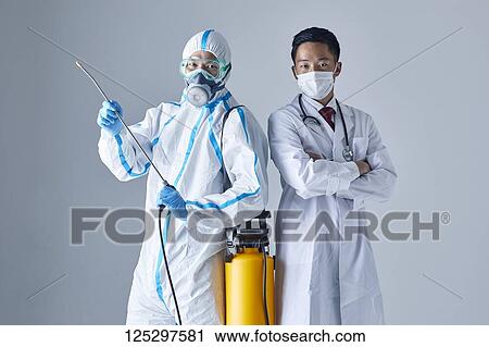 Japanese man wearing protective suit and doctor View Large Photo Image Stock Image - Japanese man wearing protective suit and doctor. Fotosearch
