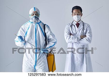 Japanese man wearing protective suit and doctor View Large Photo Image Stock Image - Japanese man wearing protective suit and doctor. Fotosearch