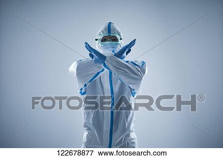 Japanese man wearing protective suit for disease prevention View Large Photo Image Stock Photo - Japanese man wearing protective suit for disease prevention. Fotosearch