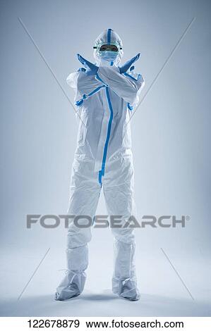 Japanese man wearing protective suit for disease prevention View Large Photo Image Stock Photo - Japanese man wearing protective suit for disease prevention. Fotosearch