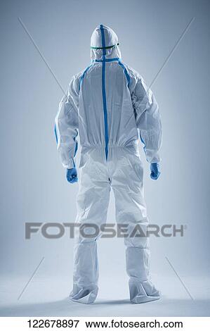 Stock Photo - Japanese man wearing protective suit for disease prevention. Fotosearch