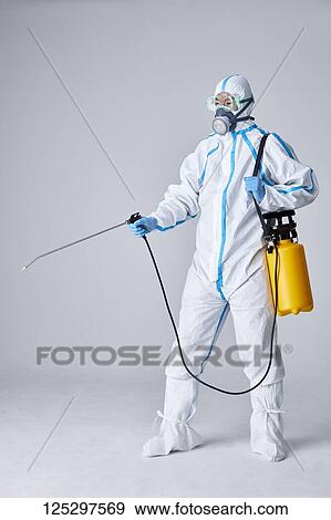 Japanese man wearing protective suit for disease prevention View Large Photo Image Stock Photo - Japanese man wearing protective suit for disease prevention. Fotosearch
