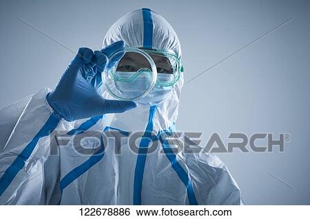 Japanese man wearing protective suit for disease prevention View Large Photo Image Stock Photograph - Japanese man wearing protective suit for disease prevention. Fotosearch