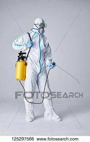 Japanese man wearing protective suit for disease prevention View Large Photo Image Stock Photograph - Japanese man wearing protective suit for disease prevention. Fotosearch