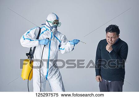 Japanese man wearing protective suit for disease prevention View Large Photo Image Stock Photography - Japanese man wearing protective suit for disease prevention. Fotosearch