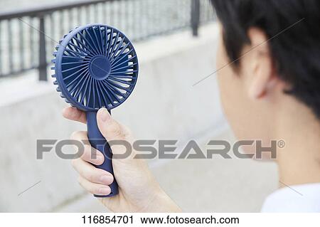 Japanese man with portable fan View Large Photo Image Stock Image - Japanese man with portable fan. Fotosearch