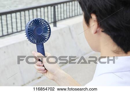 Japanese man with portable fan View Large Photo Image Stock Image - Japanese man with portable fan. Fotosearch