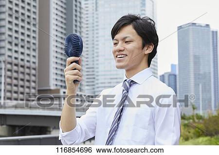 Japanese man with portable fan View Large Photo Image Stock Photograph - Japanese man with portable fan. Fotosearch