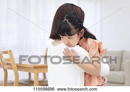 Japanese mother hugging daughter View Large Photo Image Stock Photograph - Japanese mother hugging daughter. Fotosearch