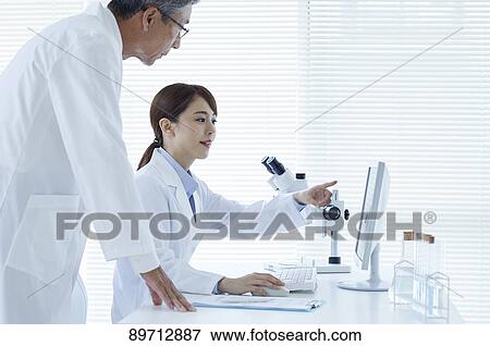 Japanese researchers in the lab View Large Photo Image Stock Photo - Japanese researchers in the lab. Fotosearch