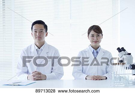 Stock Photo - Japanese researchers in the lab. Fotosearch