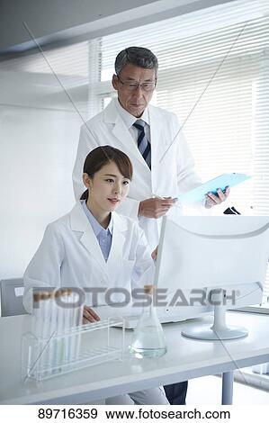 Japanese researchers in the lab View Large Photo Image Stock Photo - Japanese researchers in the lab. Fotosearch