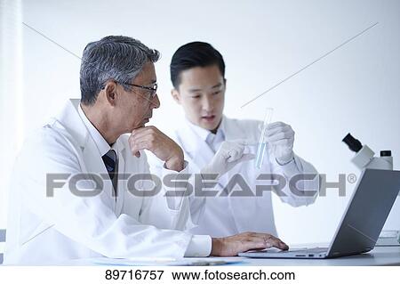 Japanese researchers in the lab View Large Photo Image Stock Photo - Japanese researchers in the lab. Fotosearch