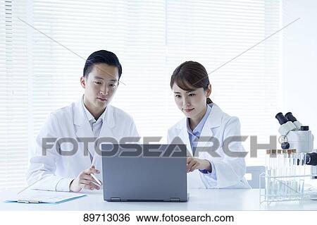 Japanese researchers in the lab View Large Photo Image Stock Photograph - Japanese researchers in the lab. Fotosearch