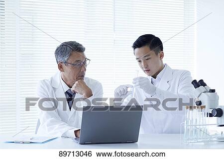 Japanese researchers in the lab View Large Photo Image Stock Photograph - Japanese researchers in the lab. Fotosearch