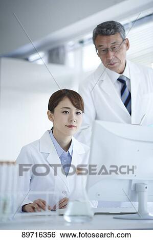 Japanese researchers in the lab View Large Photo Image Stock Photograph - Japanese researchers in the lab. Fotosearch