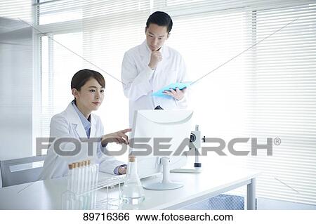 Japanese researchers in the lab View Large Photo Image Stock Photograph - Japanese researchers in the lab. Fotosearch